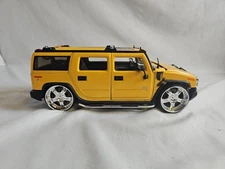 2003 Hummer H2 in 1/24 Scale Diecast by Jada Yellow Dub City #BXQ