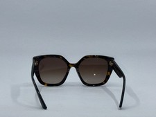 Okulary Przeciwsłoneczne Prada SPR 24X Butterfly Tortoise - usage example