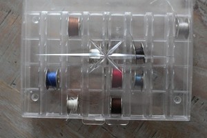 Vintage Metal Bobbins  in Case 32 holes