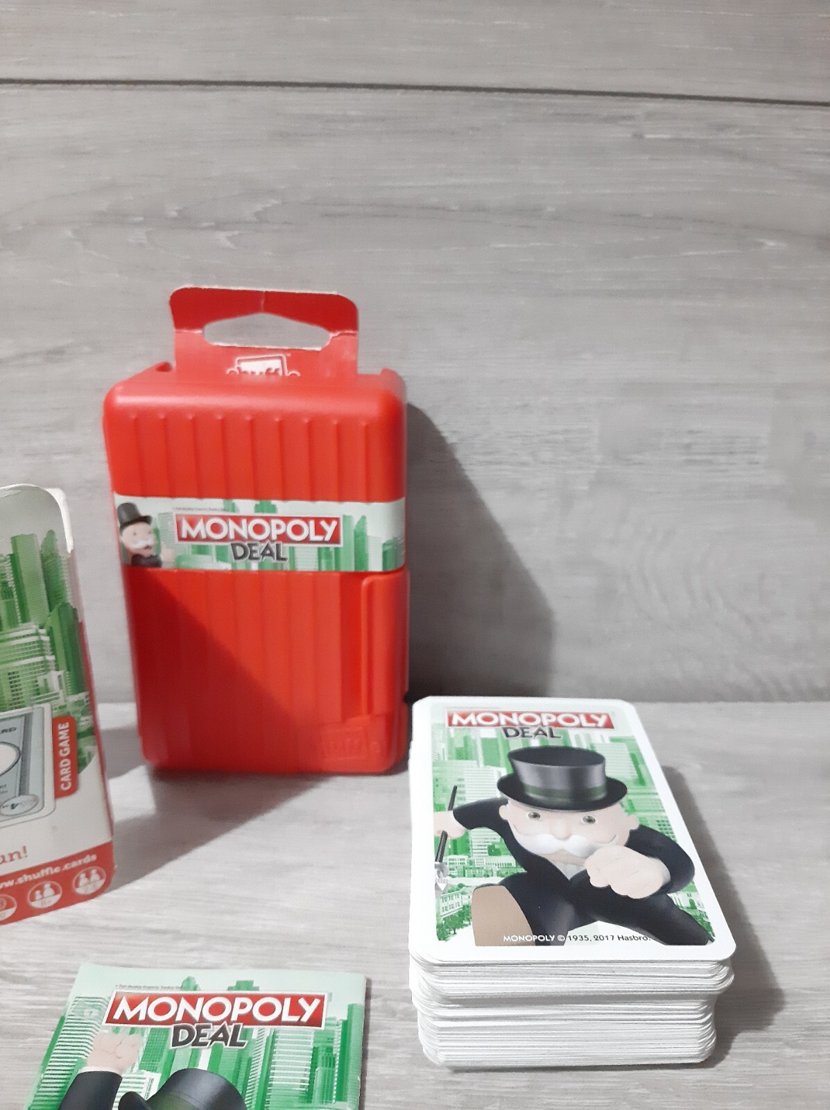 Hasbro Monopoly Deal Shuffle Card Game in Red Case Travel Quick Play