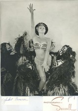 Juiet Prowse woman exotic dancer w masked figures  photo by Seawell