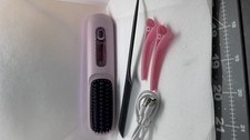 Portable cordless hair staightening comb with...