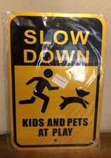 Slow Down Kids And Pets At Play Metal Sign 12 x 18 Safety Warning