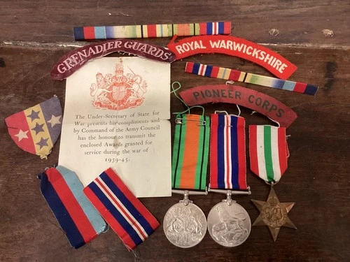 collection of original ww2 army battledress patches & medals