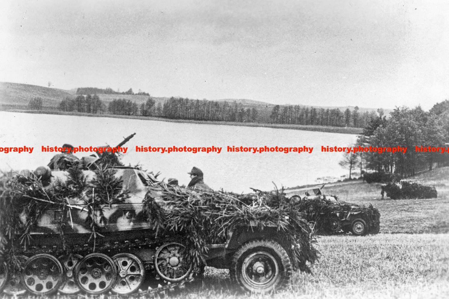F027883 SdKfz 251 1 infantry fighting vehicles gather by lake Goldap area East P