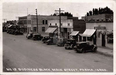 Parma Idaho Main Street Classic Cars Oregon Trail Cafe Barber RPPC Postcard COPY