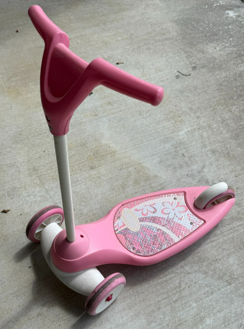 A Pink Radio Flyer My 1st Scooter Sparkle, designed for toddlers
