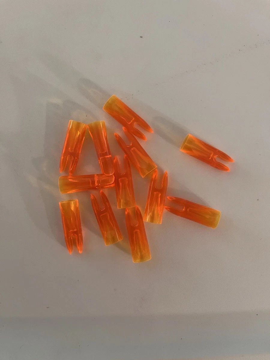 12 VINTAGE TRANS DARKER FLO ORANGE 9/32” AAE PLASTINOCK GLUE ON SNAP ARROW NOCKS