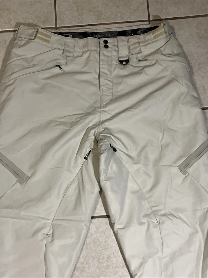 Calça de neve Oakley masculina M caimento solto bege isolamento fino logotipo esqui snowboard - Imagem 3 de 4