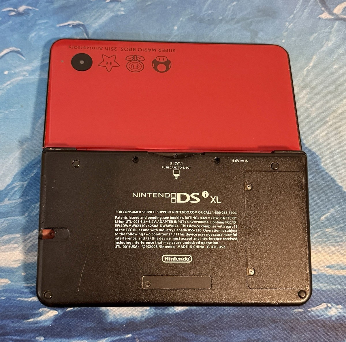 Nintendo DSi XL 25th Anniversary Edition with New Mario Bros. Red