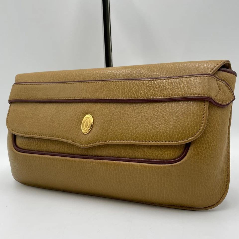 Authentique sac pochette Cartier, cuir, kaki, ligne incontournable - Photo 1/4