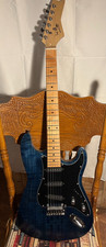 Stratocaster style electric guitar. Flame maple top.