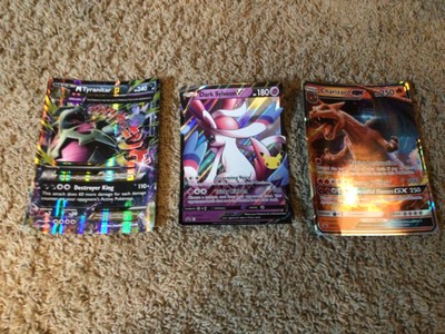 3 mega pokemon cards including charizard and two more