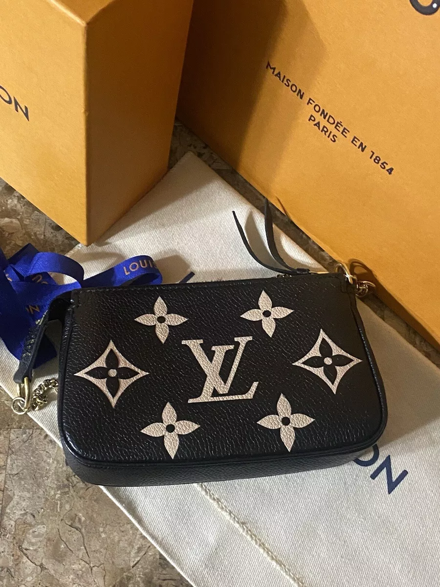 Louis Vuitton Bicolor Monogram Empreinte Leather Mini Pochette Accessoires