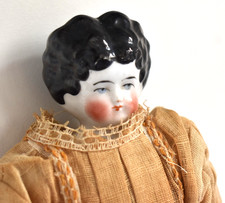 China Head Doll 11 Inch Tall- Antique on Original Body Clothes