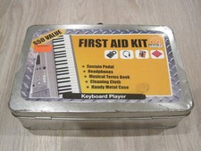Keyboard Player First Aid Kit with Sustain Pedal Headphones Book in Metal Case