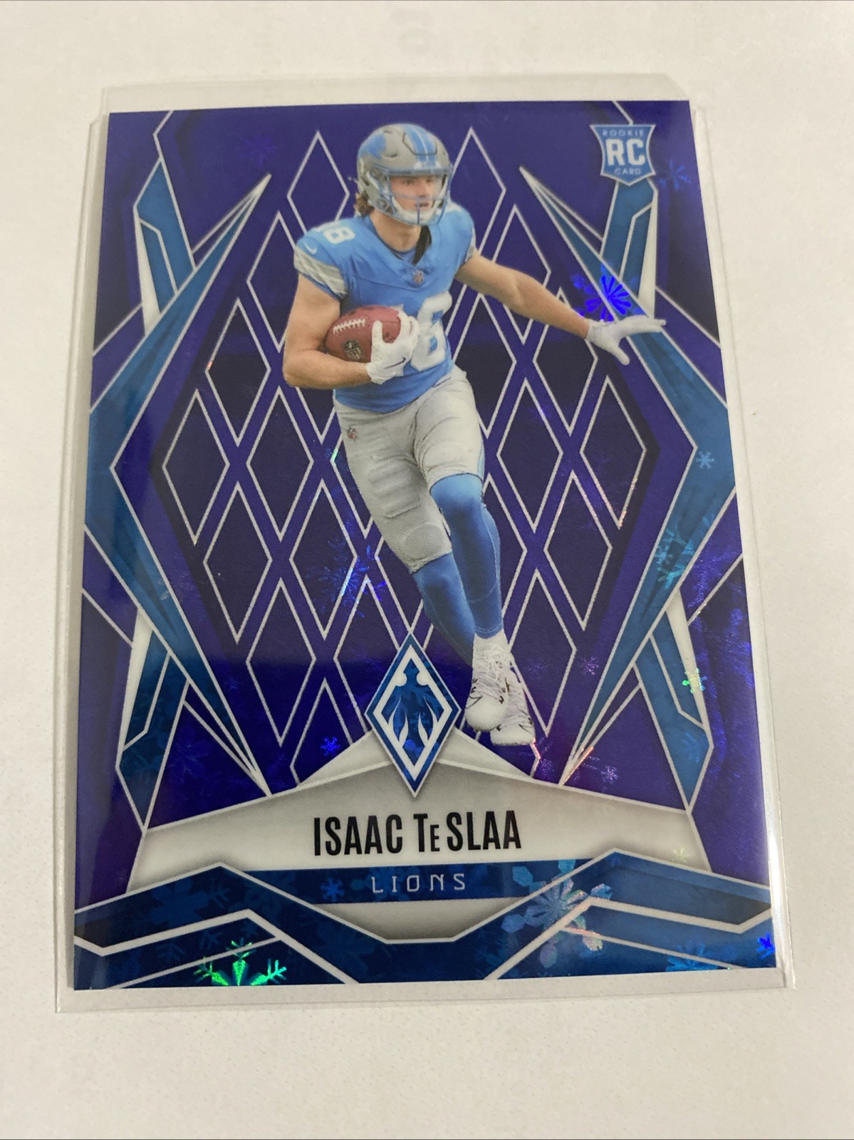 2025 Panini Phoenix - Rookies Isaac Teslaa #189 Blue Winter /199 (RC) Lions