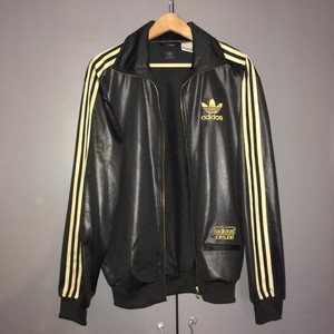 tuta adidas nera e oro