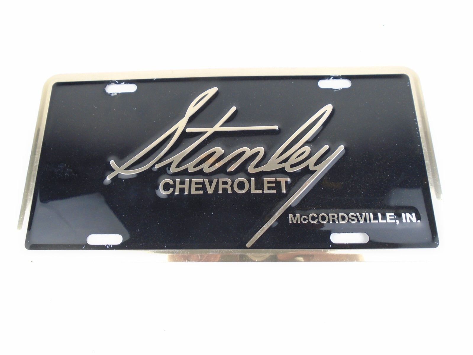 Stanley Chevrolet Booster License Plate Tag Chevy Sign McCordsville In