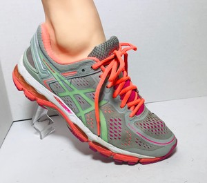 orange and green tennis shoes