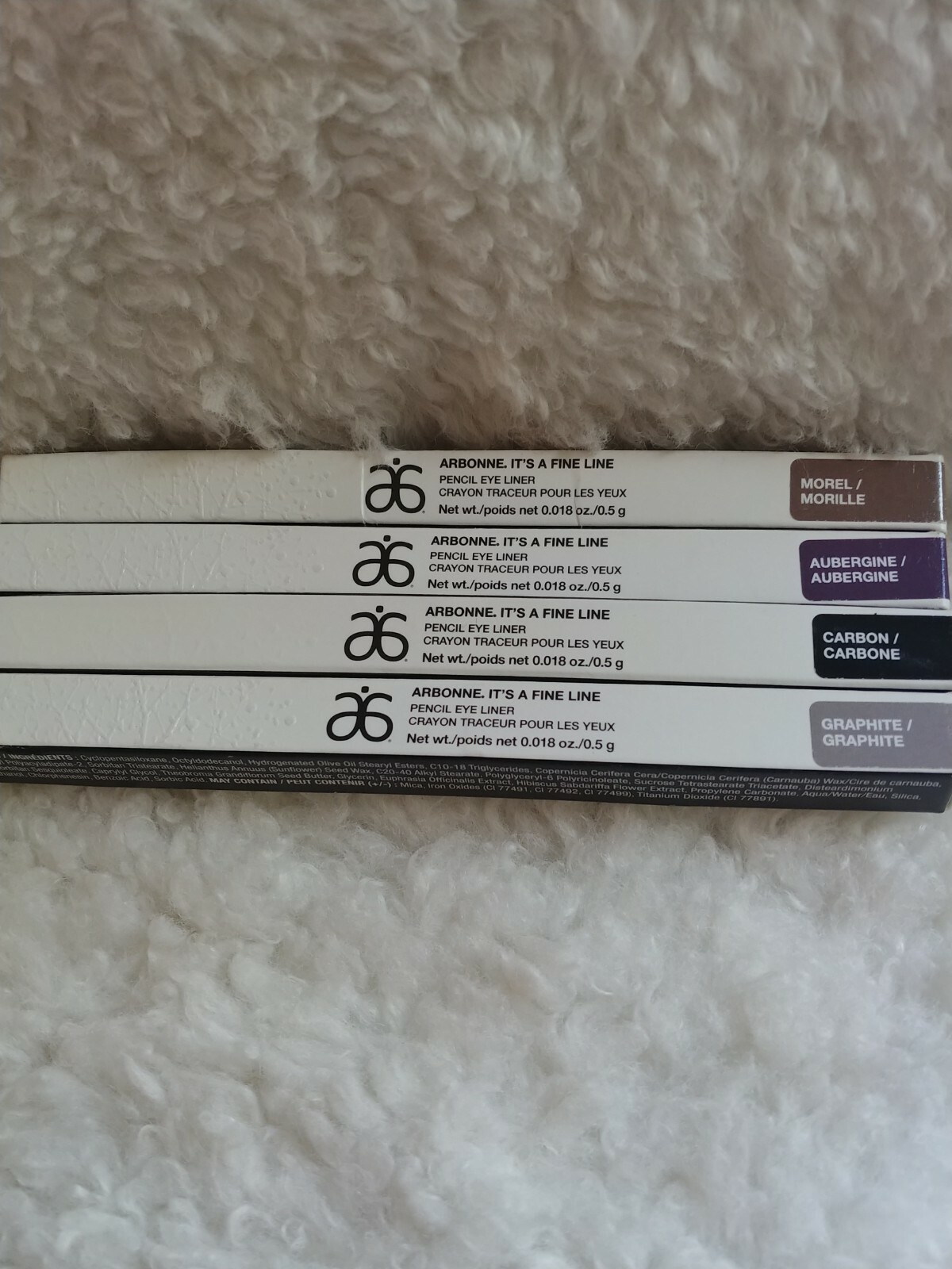Arbonne It's a fine line eyeliner color is carbon, aubergine, Graphite