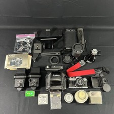 Canon AE-1 SLR Film Camera - Black With Manual, Lens, and Accessories.