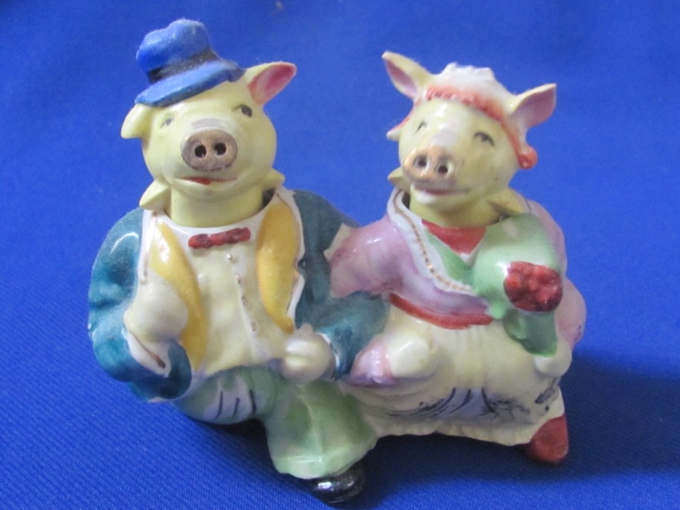 Anthropomorphic nodding walking pigs in clothes from Japan — the kind of delightfully bizarre mid-century salt & pepper set that stops every dinner guest dead in their tracks.