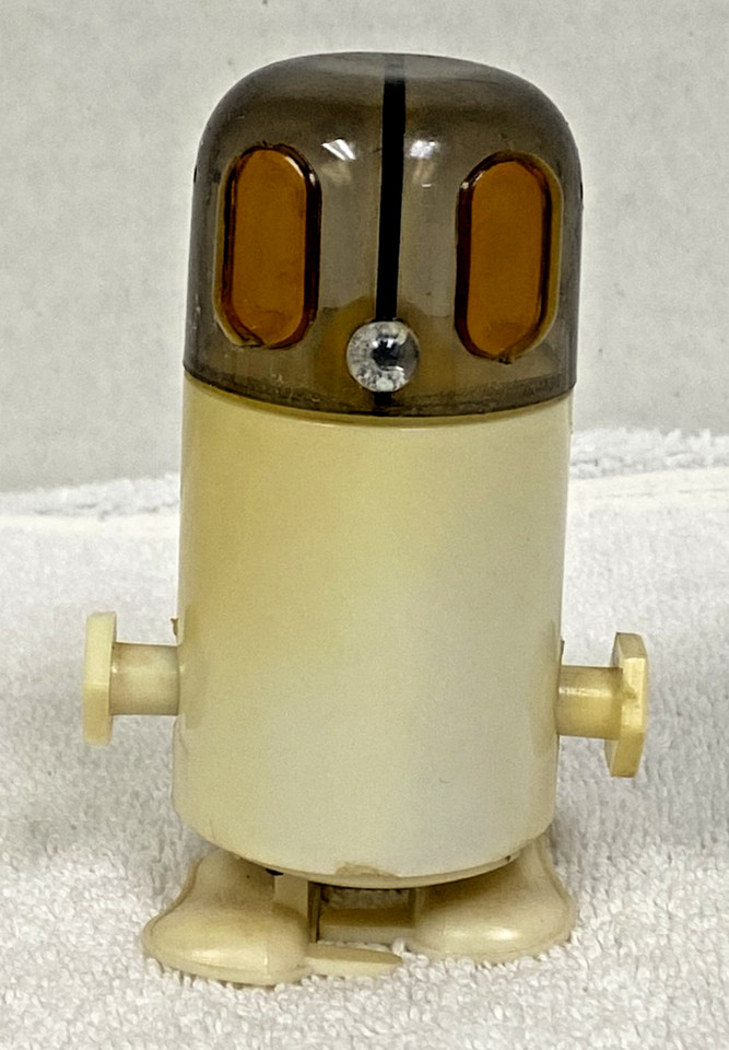 A wind-up walking robot that doubles as a salt & pepper shaker — peak 1950s kitsch and actually functional.