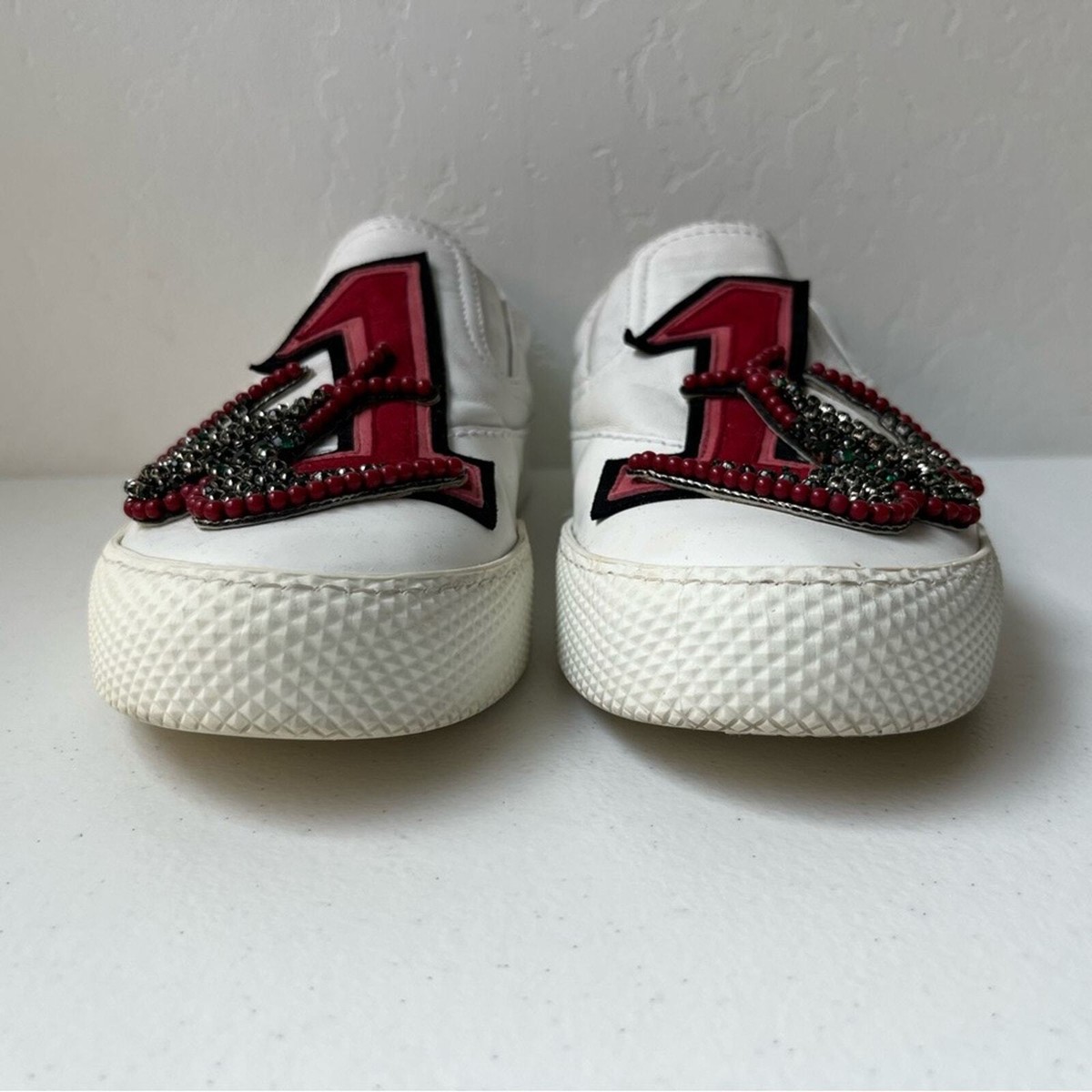 Miu Miu Embellished Patch Logo Slip-On Leather Sneakers Miu Miu Embellished Patch Logo Slip-On Leather Sneakers