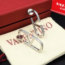 VALENTINO CRYSTAL SILVER TONE MEDIUM LOGO EARRINGS