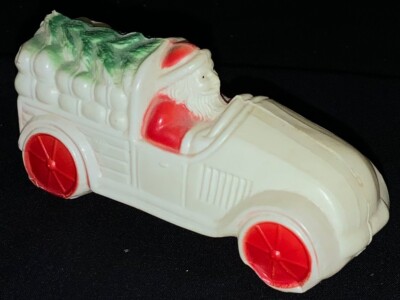 VINTAGE CELLULOID CHRISTMAS  FIGURE - SANTA DRIVING A COUPE W/PARCELS & TREE