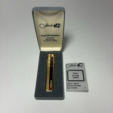 Vtg Colibri Electro Quartz Lighter Gold Thin w Scroll Work and Accent - Unused