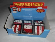 9 Toysmith Number slide puzzles, box/sale display,  2005, some new, some opened