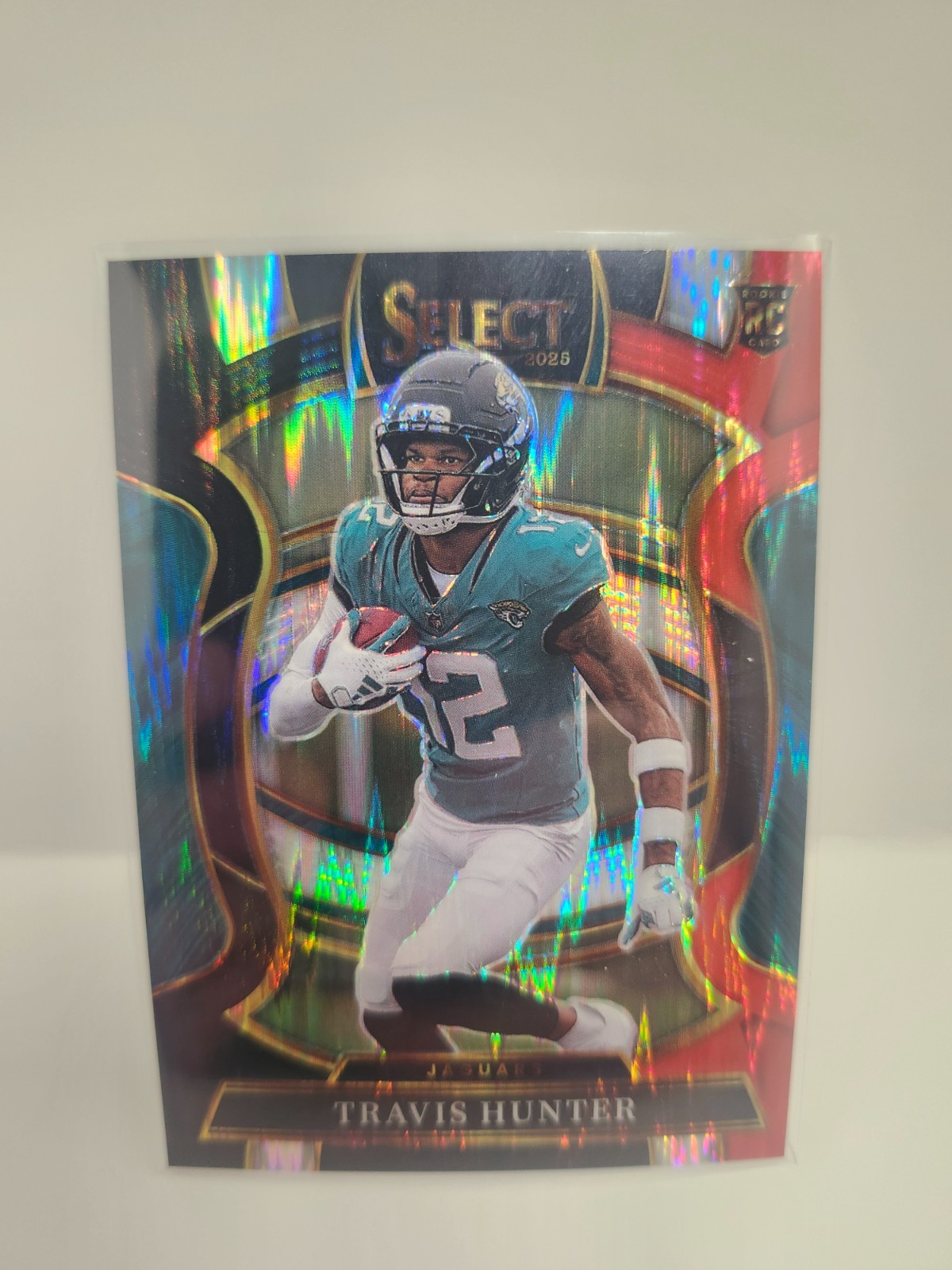 2025 Panini Select #28 Travis Hunter Black & Red Prizm Shock