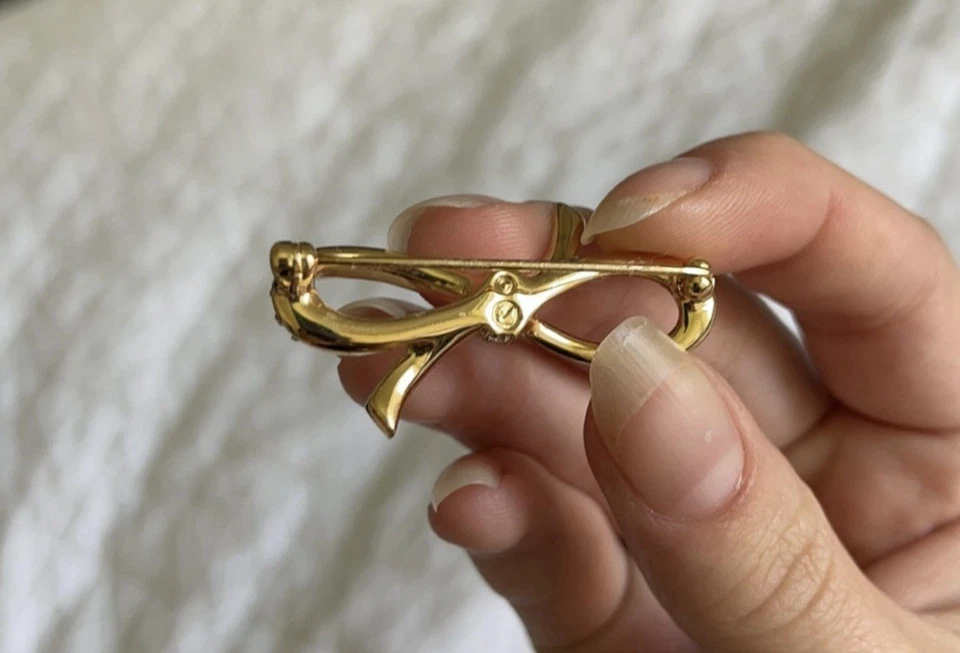 Broche prendedor de cristal con lazo dorado Swarovski Foto 4 de 4