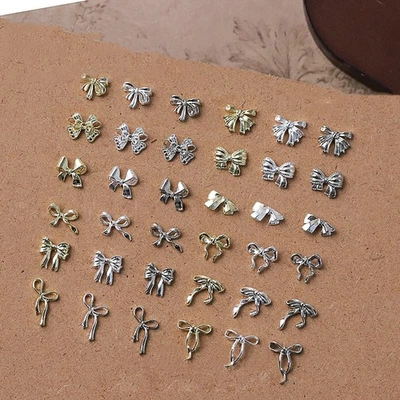 50Pcs Gold/Silver/White Metal Alloy Ribbion Bowknot Nail Charms 3D Luxury Metal - Bild 1 von 4