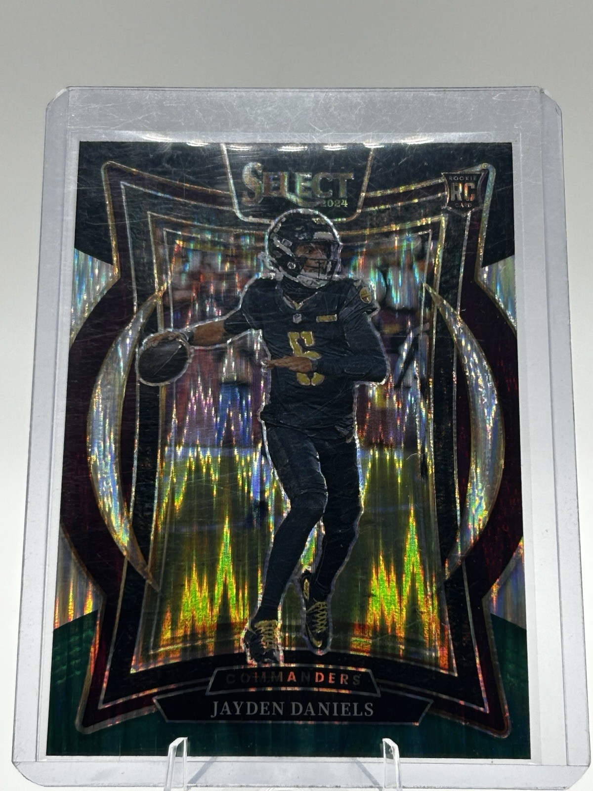 2024 Panini Select - Concourse Jayden Daniels #26 Black & Green Shock Prizm (RC)