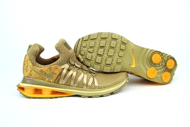 nike shox gravity women's gold