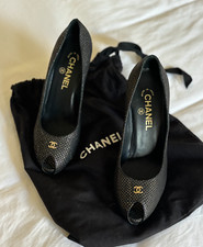 Chanel black peep-toe heels with a textured woven pattern and interlocking logo