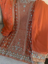 Embroidered Orange Women's Kurta with Blue and Gold Detailing