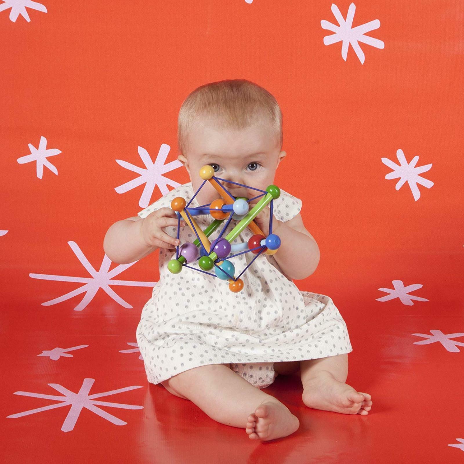 manhattan toy skwish color burst rattle and teether grasping activity toy