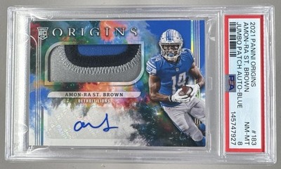 Amon-Ra St. Brown 2021 Panini Origins #183 Blue RC Jumbo Patch Auto 28/49 PSA 8
