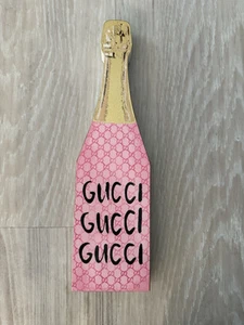 Bouteille de champagne Gucci rose luxe bois décoration maison