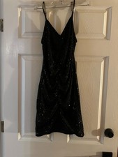 black sequin dress from The Buckle, v neck, rouching, body con fit, tiny sequins