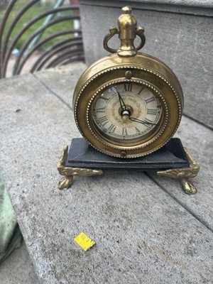 This is a vintage Timeworks brass desk or mantel clock, identified as the ''Rue