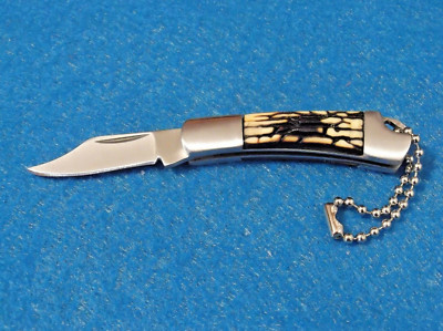 SZCO 210950 Jigged Bone Mini Keychain Clip Point Folding
