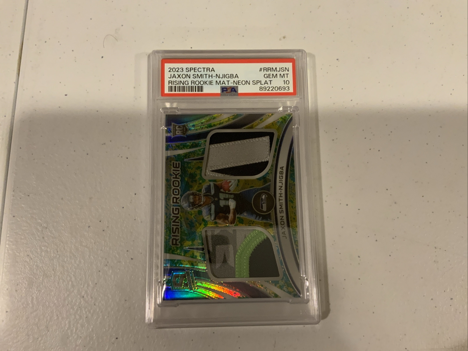 Jaxon Smith-Njigba Panini Spectra Rising Rookie Materials #RRMJSN Neon Splatter