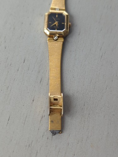 Reloj Elgin ED300-009 Diamantes Talla Batería nueva 5 3/4" dorada negra funcionando - Imagen 6 de 10