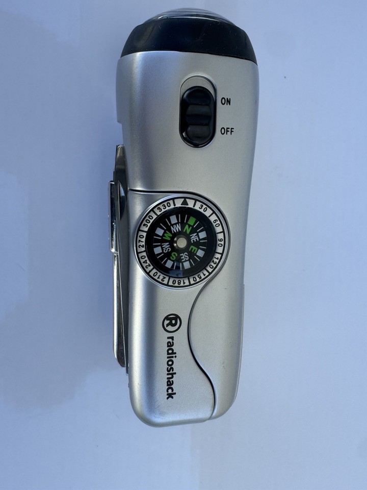 A genuine RadioShack relic — this survival multi-tool packs compass, flashlight, and EDC tools into a time-capsule piece of 80s/90s American electronics nostalgia.