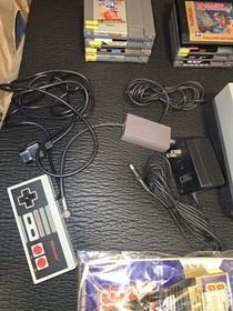 Nintendo NES with Game Genie and Games